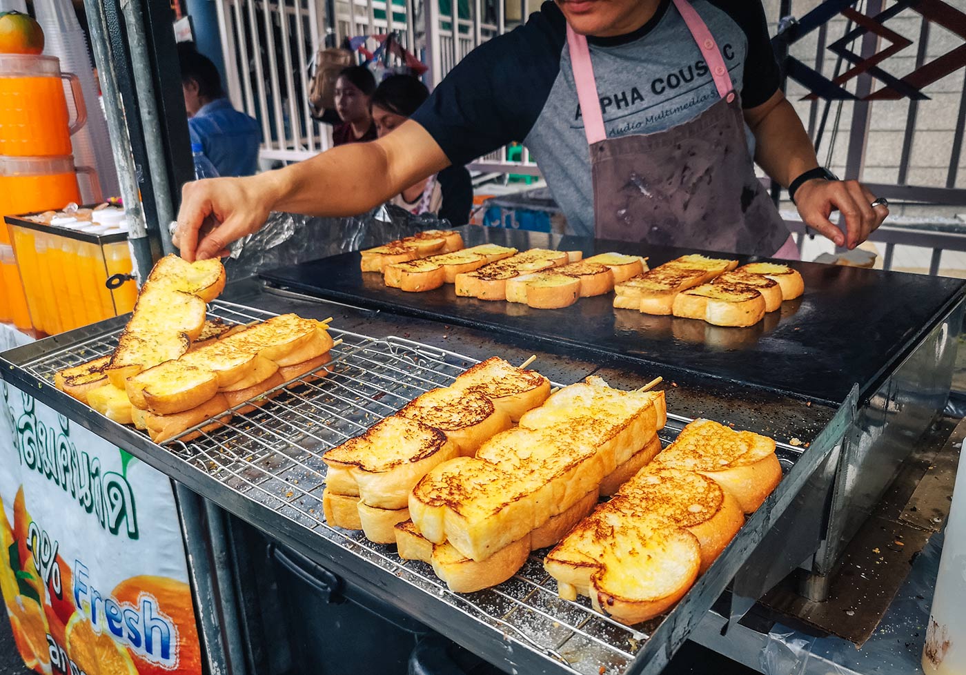 Garlic bread on a stick at Chatuchak Weekend Market in Bangkok 