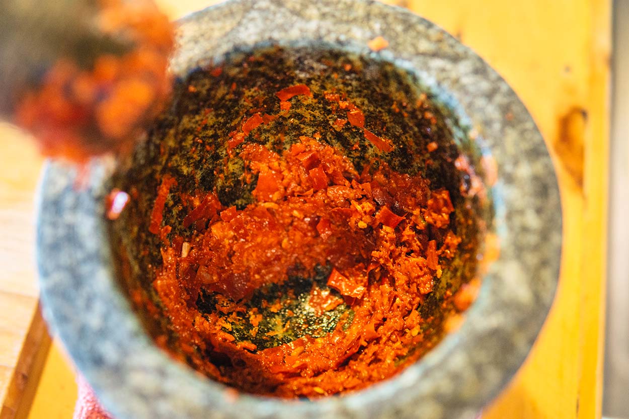 thai red curry paste in pestle and mortar